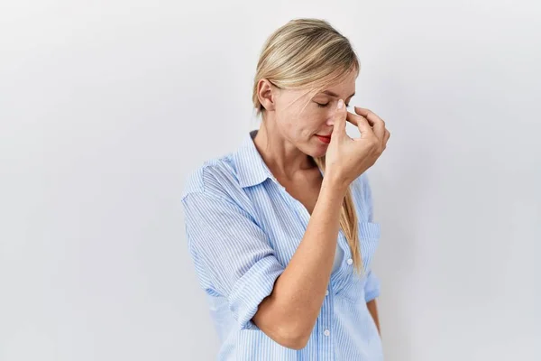 Beautiful Blonde Woman Standing White Background Tired Rubbing Nose Eyes — Stockfoto