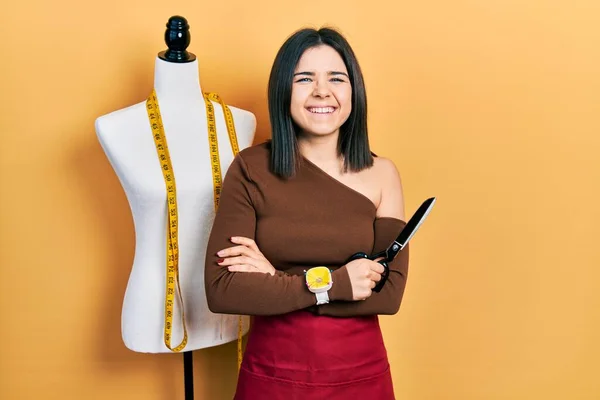 Young Brunette Woman Standing Manikin Holding Scissors Smiling Laughing Hard — Stok fotoğraf