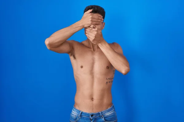 Young Hispanic Man Standing Shirtless Blue Background Covering Eyes Mouth — Fotografia de Stock