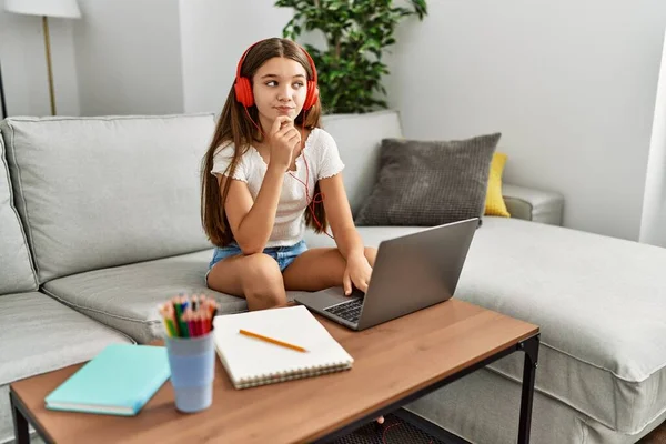 Young Brunette Teenager Doing Homework Laptop Home Serious Face Thinking — Stockfoto