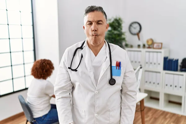 Middle Age Doctor Man Clinic Patient Making Fish Face Lips — Stock fotografie