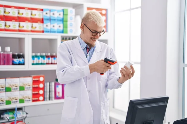 Young Caucasian Man Pharmacist Scanning Pills Pharmacy — Zdjęcie stockowe
