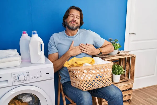 Handsome Middle Age Man Waiting Laundry Smiling Hands Chest Closed —  Fotos de Stock