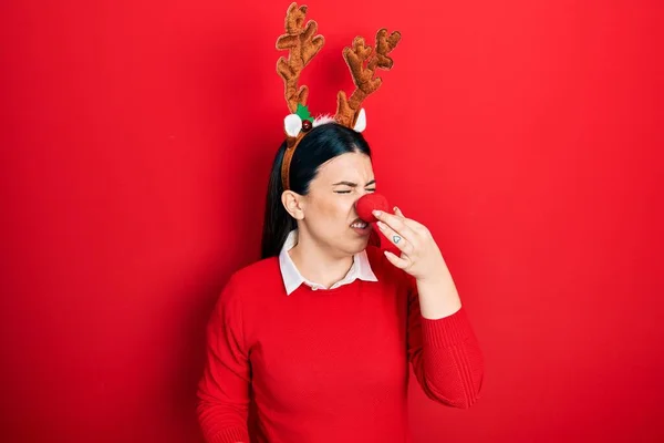 Young Hispanic Woman Wearing Deer Christmas Hat Red Nose Smelling — Photo