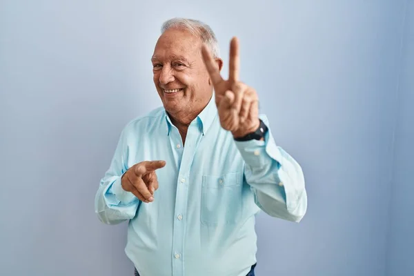 Senior Man Grey Hair Standing Blue Background Smiling Looking Camera — Stockfoto