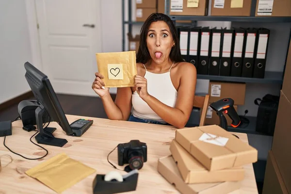 Young Hispanic Woman Working Small Business Ecommerce Sticking Tongue Out — Stock Photo, Image
