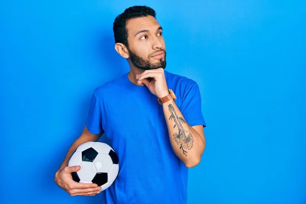 Hispanic Man Beard Holding Soccer Ball Hand Chin Thinking Question — Fotografia de Stock