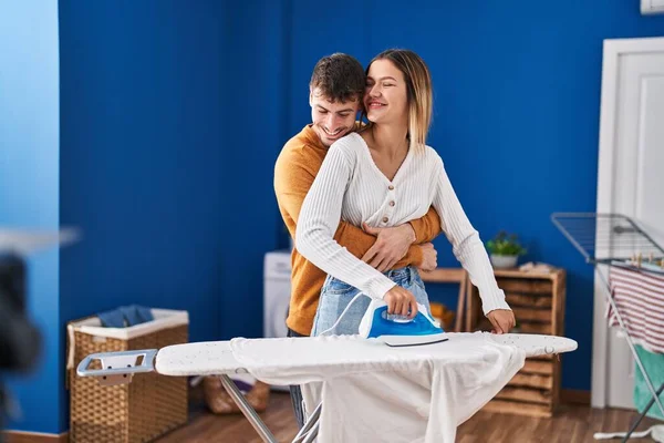 Young Man Woman Couple Hugging Each Other Ironing Clothes Laundry — Stockfoto