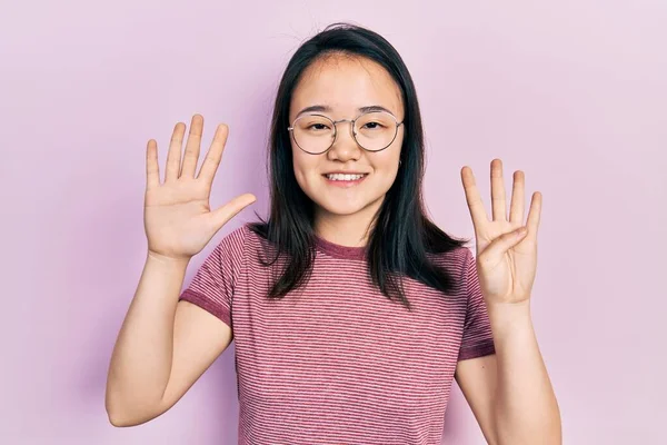 Young Chinese Girl Wearing Casual Clothes Glasses Showing Pointing Fingers — Stockfoto