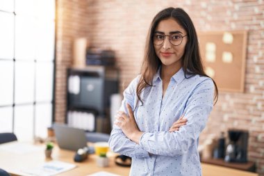 Young hispanic girl at office