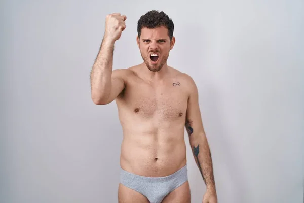 Young Hispanic Man Standing Shirtless Wearing Underware Angry Mad Raising — Stock Photo, Image