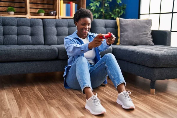 African American Woman Playing Video Game Sitting Floor Home — Stok fotoğraf