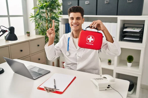 Young Hispanic Doctor Man Holding First Aid Kit Smiling Idea — Foto de Stock