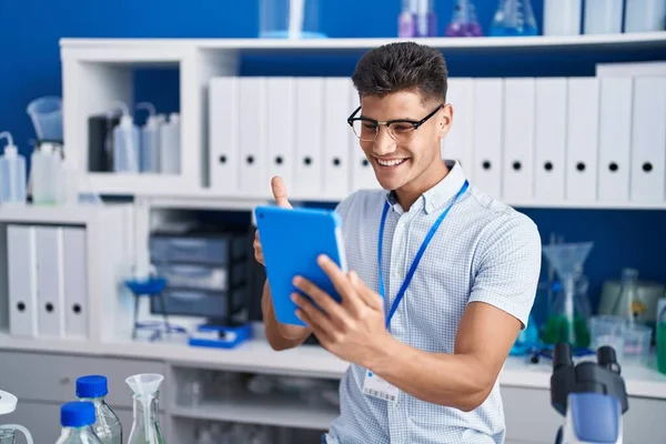 Young Hispanic Man Working Scientist Laboratory Doing Video Call Smiling — Stockfoto