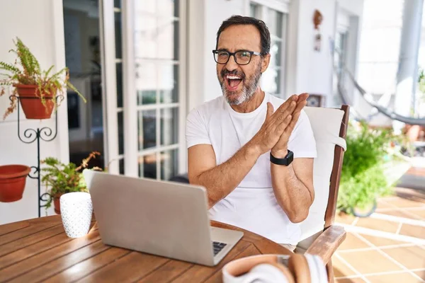 Middle Age Man Using Computer Laptop Home Clapping Applauding Happy — Stockfoto