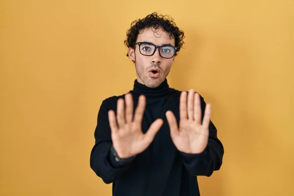 Hispanic Man Standing Yellow Background Moving Away Hands Palms Showing — Fotografie, imagine de stoc