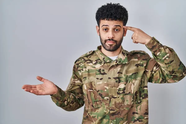 Arab Man Wearing Camouflage Army Uniform Confused Annoyed Open Palm — Stock Photo, Image