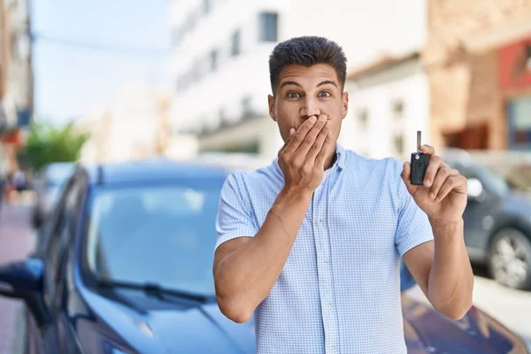 Young Hispanic Man Holding Car Key Covering Mouth Hand Shocked — Stock fotografie