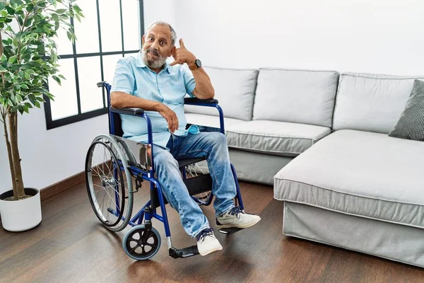 Handsome Senior Man Sitting Wheelchair Living Room Smiling Doing Phone — Fotografia de Stock