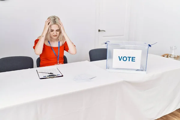 Young Caucasian Woman Political Election Sitting Ballot Suffering Headache Desperate — Stockfoto