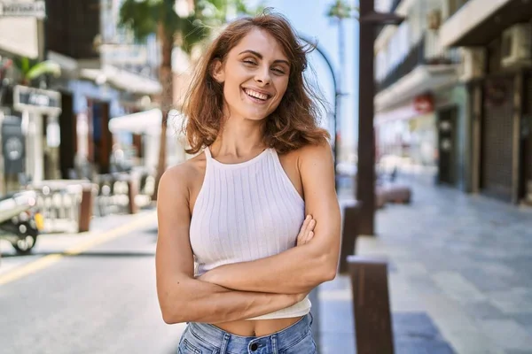 Young caucasian woman smiling confident at street