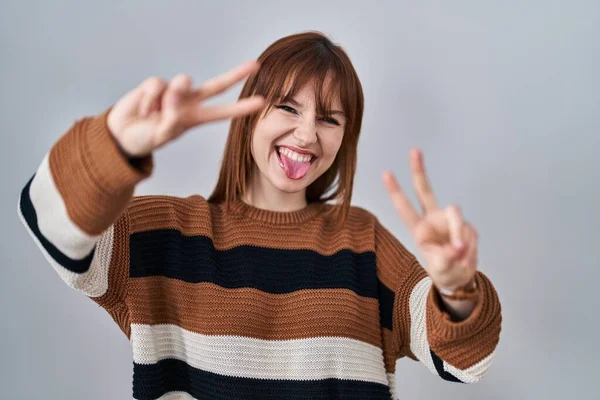 Young Beautiful Woman Wearing Striped Sweater Isolated Background Smiling Tongue — Stock Photo, Image