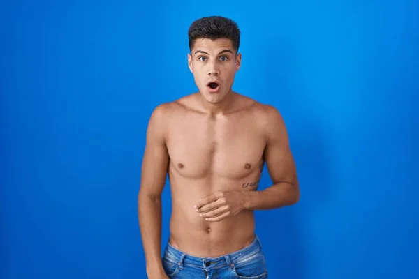 Young Hispanic Man Standing Shirtless Blue Background Afraid Shocked Surprise — Zdjęcie stockowe