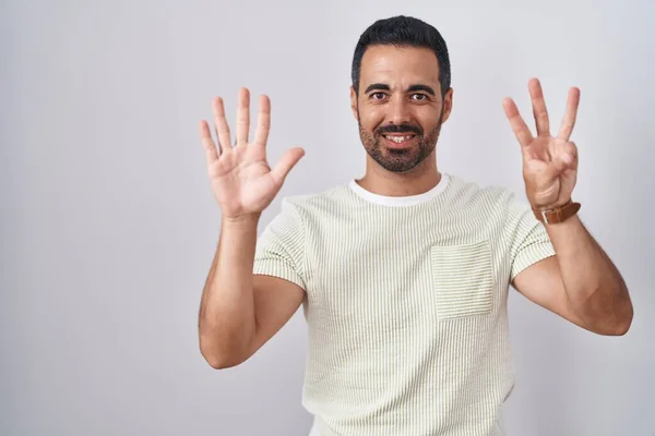 Hispanic Man Beard Standing Isolated Background Showing Pointing Fingers Number — стоковое фото