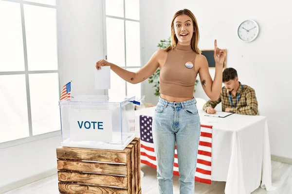 Young Blonde Girl Voting Putting Envelop Ballot Box Surprised Idea — ストック写真