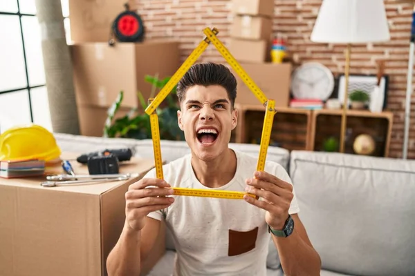 Young Hispanic Man Moving New Home Angry Mad Screaming Frustrated — ストック写真