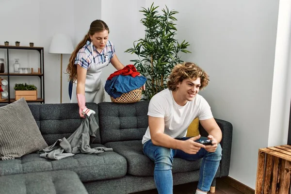 Woman Doing Laundry While Man Plays Video Game Home — Stock Photo, Image