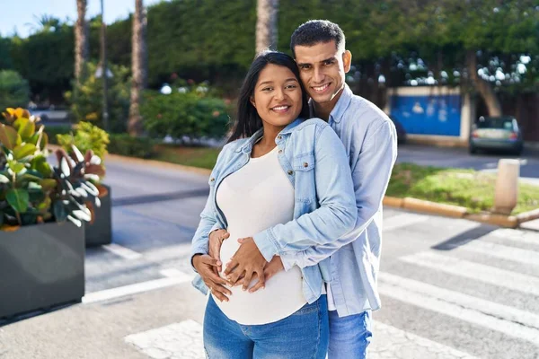 Young Latin Couple Expecting Baby Hugging Each Other Standing Street — Photo