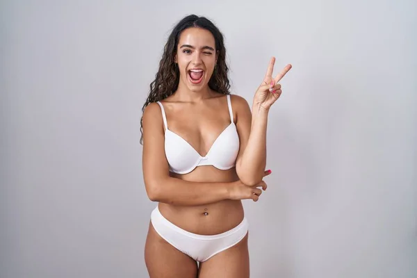 Young Hispanic Woman Wearing White Lingerie Smiling Happy Face Winking — Stock Photo, Image