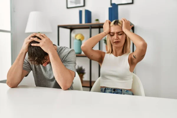 Young Beautiful Couple Wearing Casual Clothes Sitting Table Home Suffering — Stockfoto