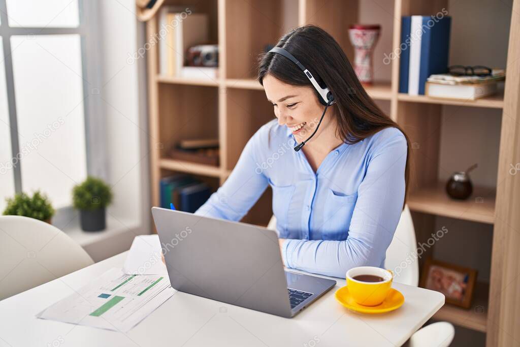 Young woman call center agent working at home
