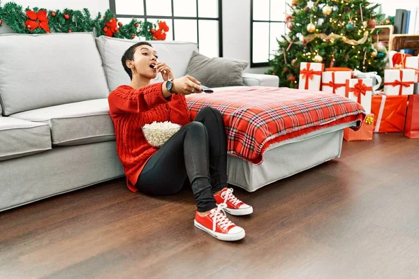 Young Hispanic Woman Watching Movie Sitting Christmas Tree Home — Fotografia de Stock