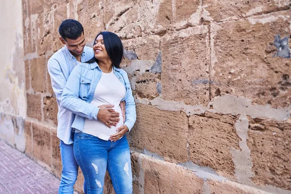 Young Latin Couple Expecting Baby Touching Belly Street — Stockfoto