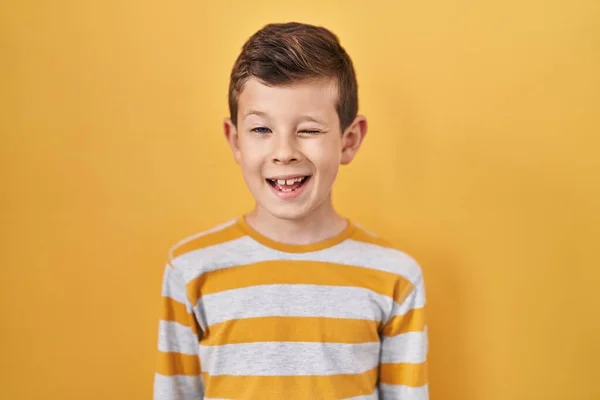 Young Caucasian Kid Standing Yellow Background Winking Looking Camera Sexy — Stock Photo, Image