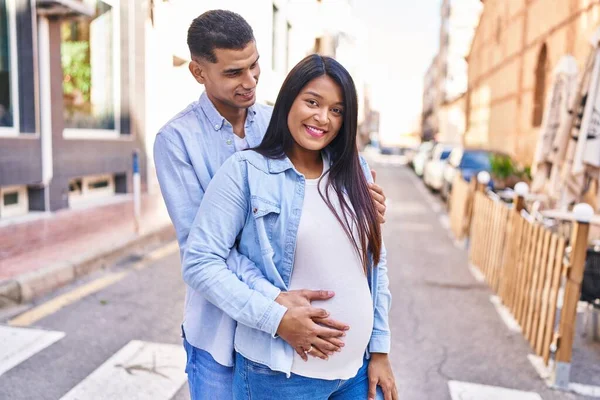 Young Latin Couple Expecting Baby Hugging Each Other Standing Street — Photo