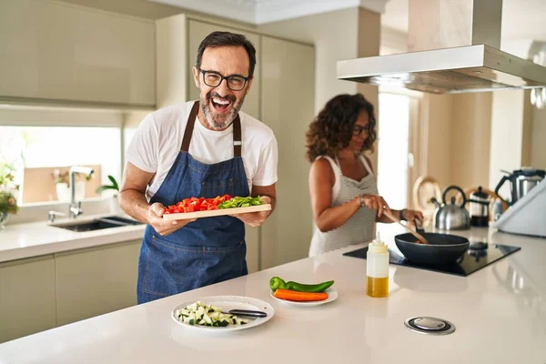 Middle Age Couple Cooking Mediterranean Food Home Smiling Laughing Hard — Stock Fotó