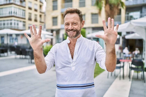 Middle Age Man Outdoor City Showing Pointing Fingers Number Ten — Stok fotoğraf