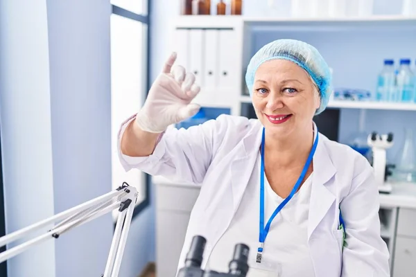 Middle Age Blonde Woman Wearing Scientist Uniform Holding Sample Laboratory — 스톡 사진