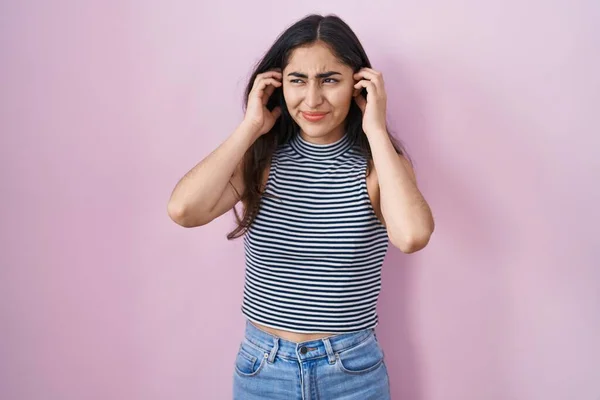 Young Teenager Girl Wearing Casual Striped Shirt Covering Ears Fingers —  Fotos de Stock