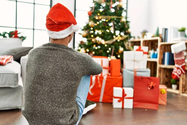 Young Hispanic Man Back View Sitting Christmas Tree Home — Fotografia de Stock