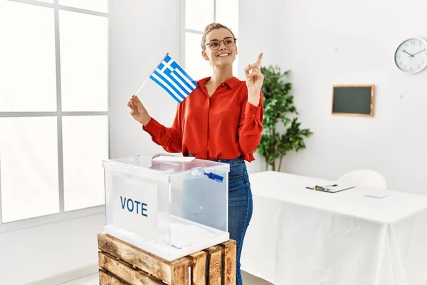 Young Brunette Woman Putting Envelop Ballot Box Holding Greece Flag — Stock Photo, Image