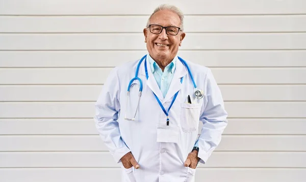 Senior Man Wearing Doctor Uniform Standing White Isolated Background — ストック写真
