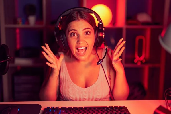 Young Blonde Woman Playing Video Games Wearing Headphones Celebrating Crazy — Photo