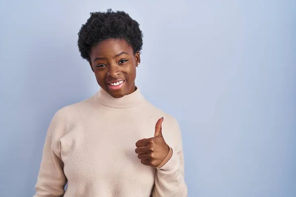 African American Woman Standing Blue Background Doing Happy Thumbs Gesture — Stock fotografie