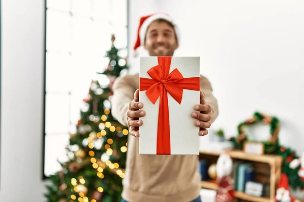 Young Hispanic Man Smiling Confident Holding Christmas Gift Home — Stock Photo, Image
