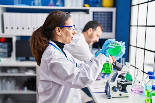 Middle Age Man Woman Scientists Measuring Liquid Laboratory — Fotografia de Stock